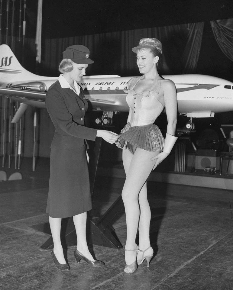 Swedish stewardess Birgitta Lindman, examines a new uniform proposal for the
Swedish SAS airline.
The Uniform wasn't approved!
Jan. 12, 1959.