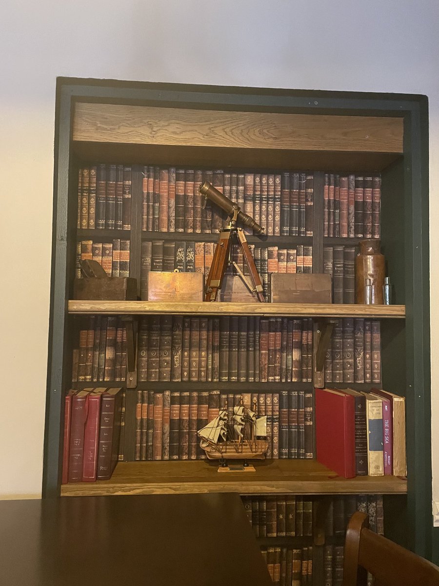 onlinereaders1's tweet image. Post conf drinks no getting away from bookish vibes. Fake book wallpaper and random book/misc spesh ⁦@StevieLMarsden⁩ #movingtexts2021