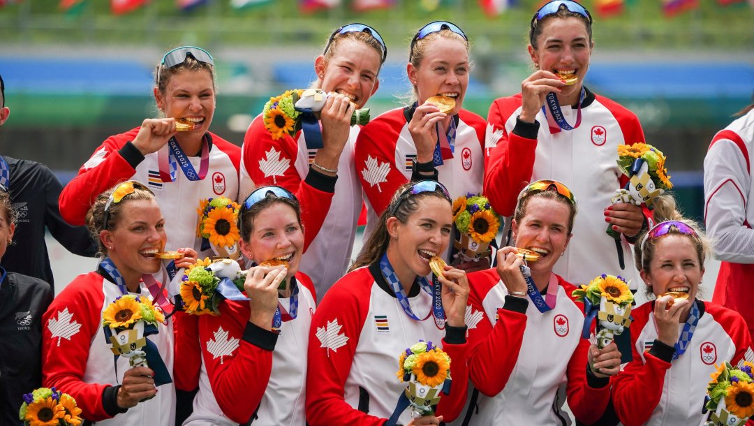 Team Canada rowing eight celebrates with its gold medal.