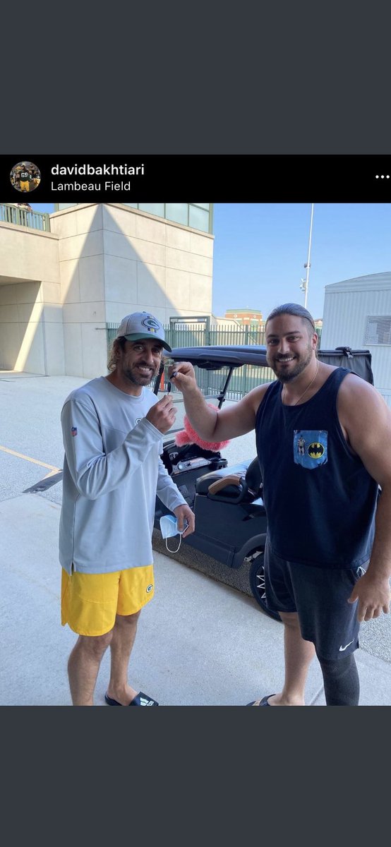 This looks like a son gifting his father a golf cart at the old folks home