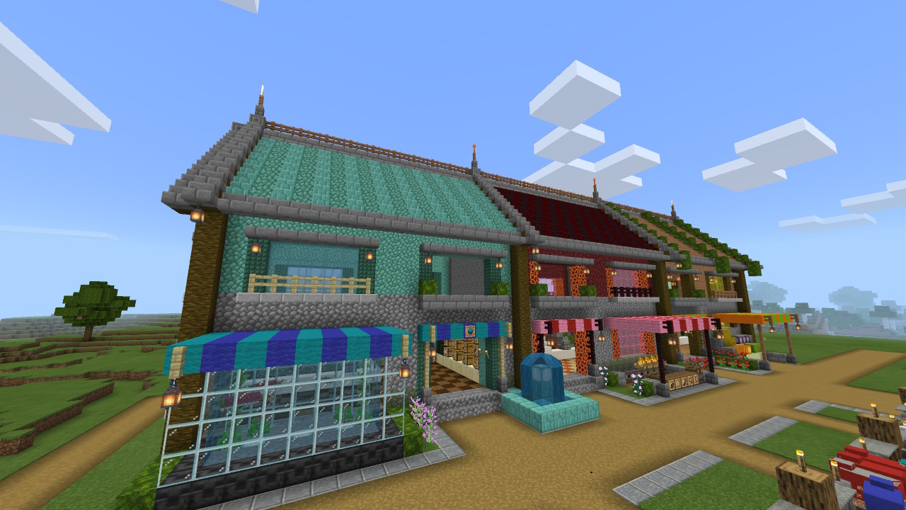 鹿日まどか 魚屋が完成 商店街ができました 商品が魚のみだと寂しいので 発光イカスミ等も並べました 店先にはアクアリウムを置きました 個々は地味ですが 3件並ぶとまあまあカラフルで賑やかだと思います Minecraft マイクラ マインクラフト