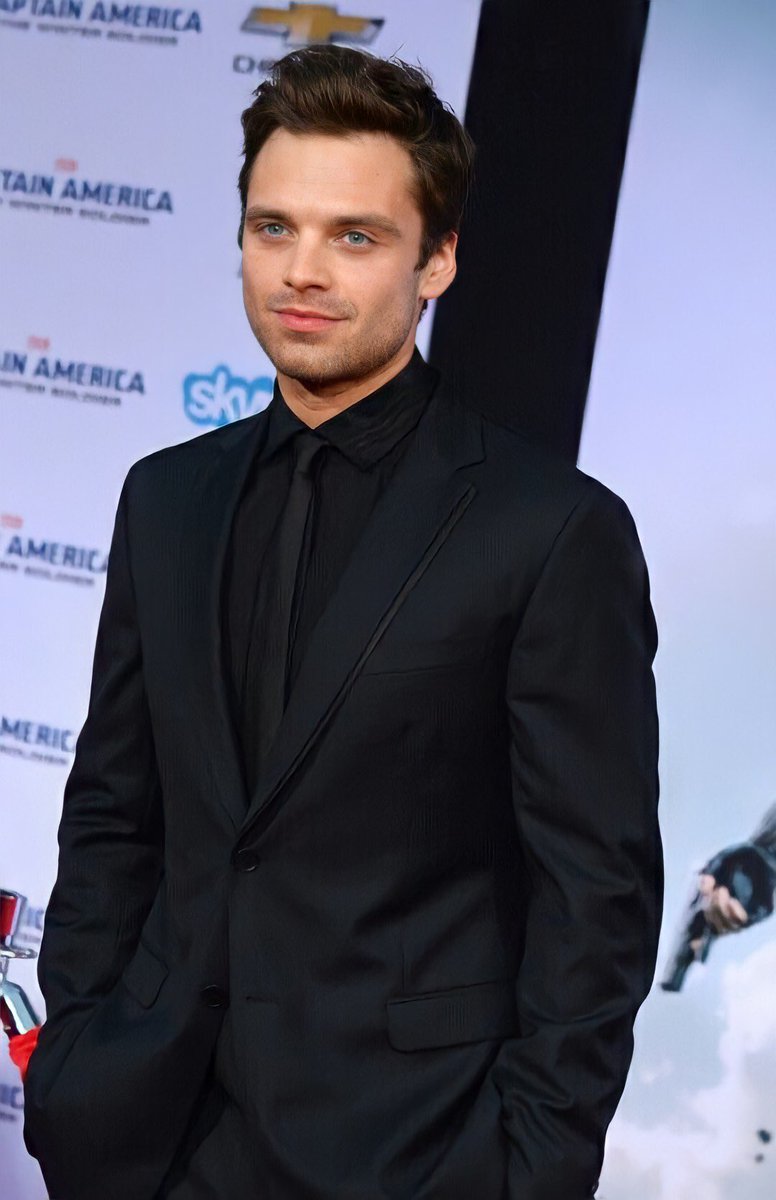 hourlyseb's tweet image. Sebastian Stan in a black suit