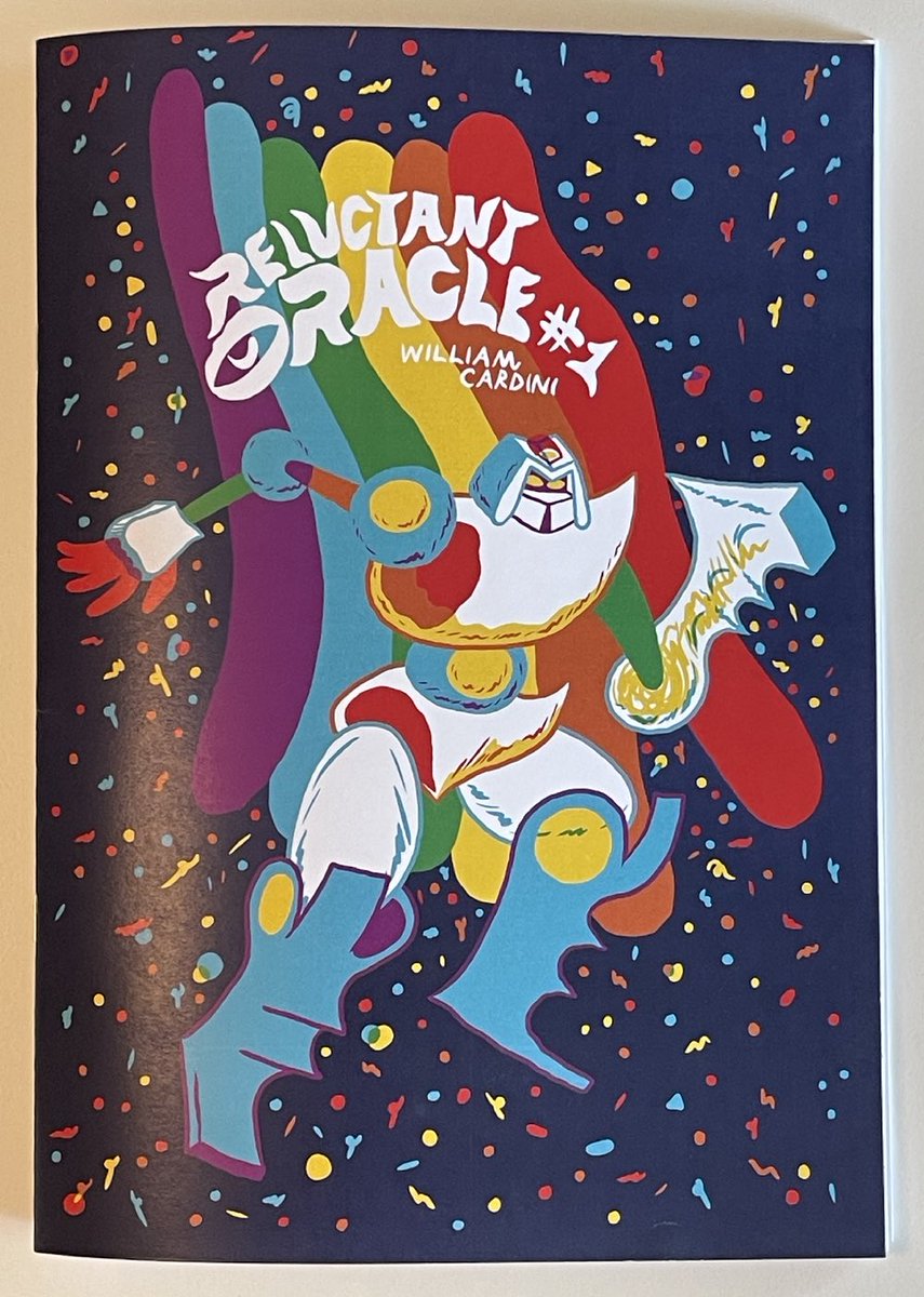 The cover of a book titled Reluctant Oracle #1. Below the title is the artist’s name, William Cardini. The cover shows an armored being, perhaps a robot, with a misshapen hammer for a hand. It is floating in space, with a rainbow immediately behind it.