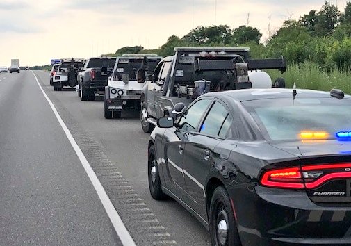 OPP_HSD's tweet photo. 4 drivers charged with #StreetRacing #Hwy401 WB near Hwy25 #Milton. 
#OPPHighwayEnforcentTeam observed 4 tow trucks racing one another, driving on the shoulder, passing dangerously and making unsafe lane changes.
#14DayVehicleImpoumd
#7DayLicenceSuspension https://t.co/lorFiOyVu8
