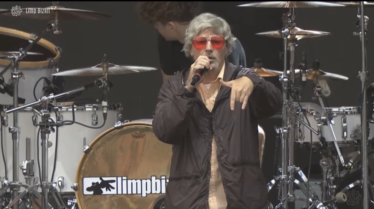 notsam's tweet photo. Fred Durst rolling in to Lollapalooza with Dad pants and a grey wig doing cheesy dances and absolutely crushing like he’s 2021’s cool Uncle from 1999 is going to be my energy from here on. 

Unbelievable set. Respect the legend. Limp Bizkit is eternal.  Fred is a genius. https://t.co/ro6s6N7IQt