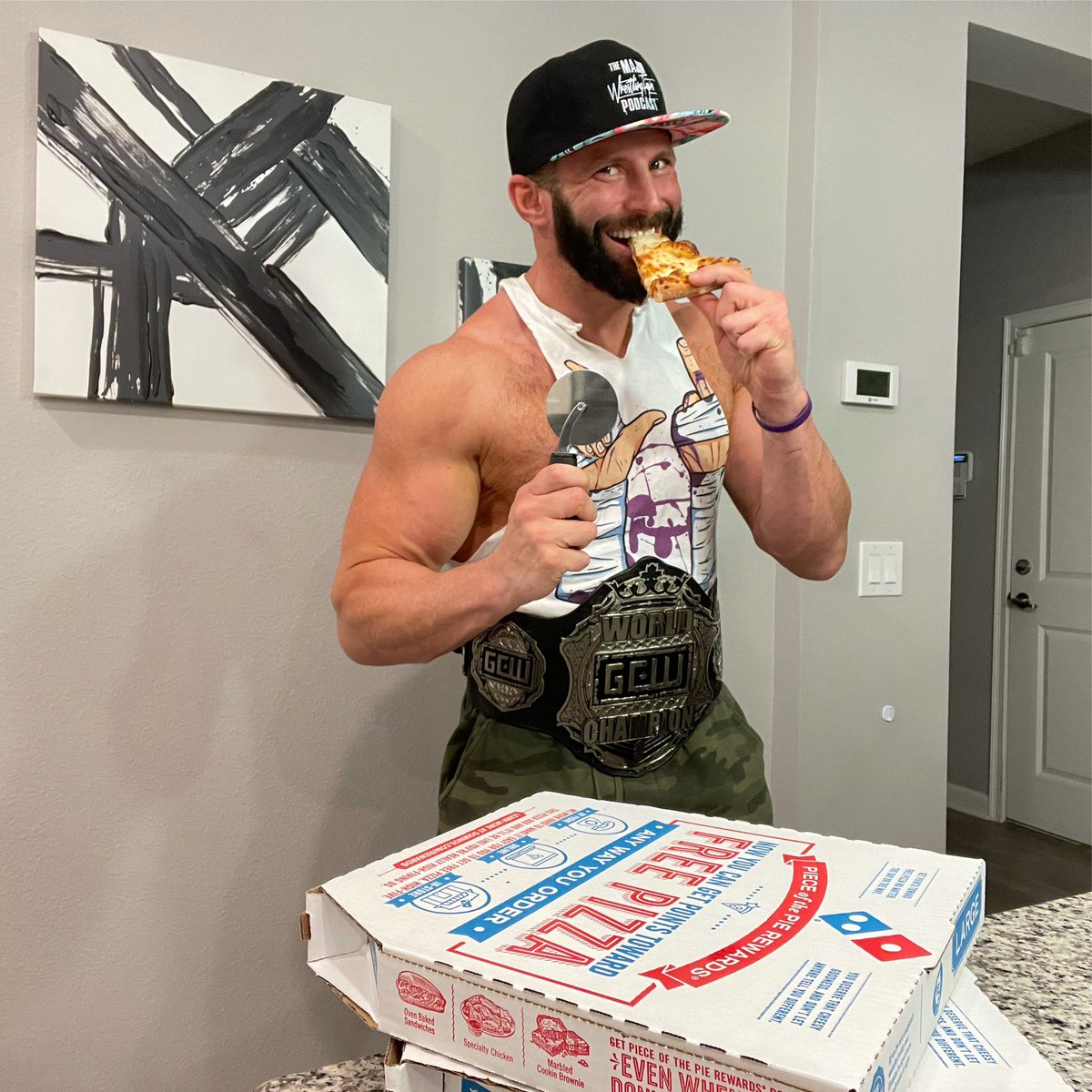 Enjoying some <a href="/dominos/">Domino's Pizza</a> pizza! It’s great to be the <a href="/GCWrestling_/">GameChangerWrestling</a> World Champ!