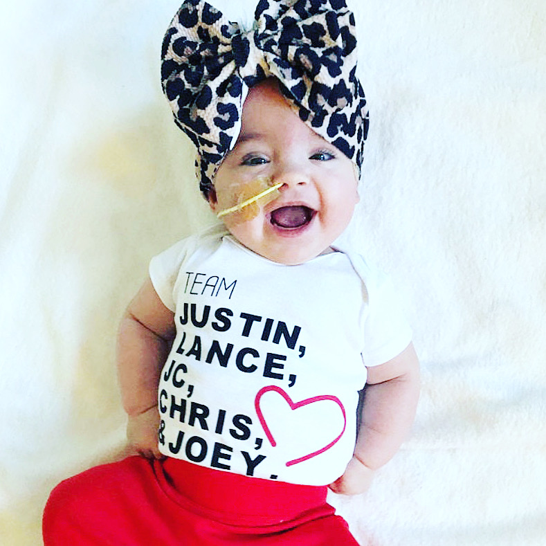 moderngrin's tweet photo. This little one melts my heart! One of @moderngrin's  beautiful customers posted this and I couldn’t help but repost! Perfectly accessorized and just the cutest in that #teamnsync onesie! Leopard print for the win, always!
#nsync #nsyncfan #battleoftheboybands #boyband #onesie https://t.co/afeAg7E8W0
