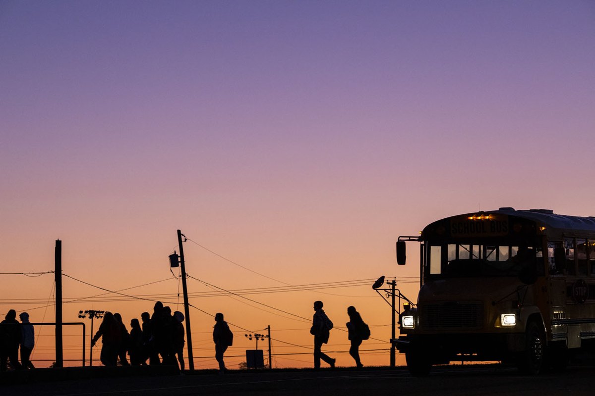 mtnworkshops's tweet photo. Students make their way from a bus at Harrison County High School as the sun rises on a late October morning. More than 900 students arrive by bus, car and foot to attend the school. 
Photo by Kelley Jordan Schuyler https://t.co/7UzEltBkqf