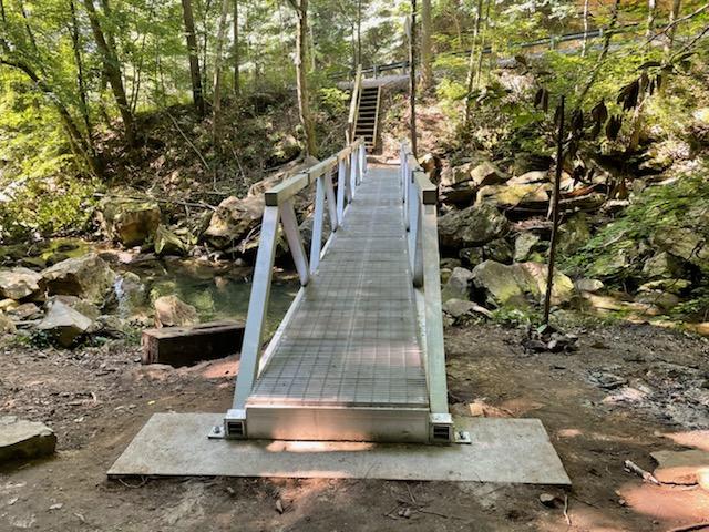 The Soak Creek Bridge install has seen great progress thanks to the assistance from the National Guard, several Seasonal Interpretive Recreators from across Tennessee State Parks, and many others! 

Image Courtesy: CT Park Manager Joshua Kuykendall