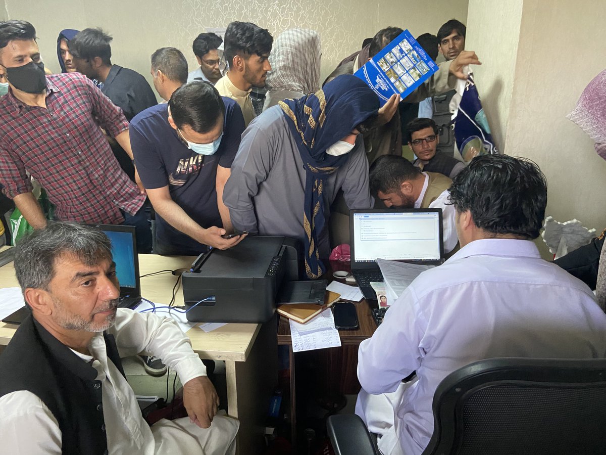 RichardEngel's tweet photo. Afghans at a visa processing office in kabul just now. One man, overwhelmed, trying to help Afghans fill out US state dept forms (in english).  Desperation. Many people came up to me crying, saying the need to leave, fear for their lives as Taliban closes in on Kabul. https://t.co/zDodmUsBvl