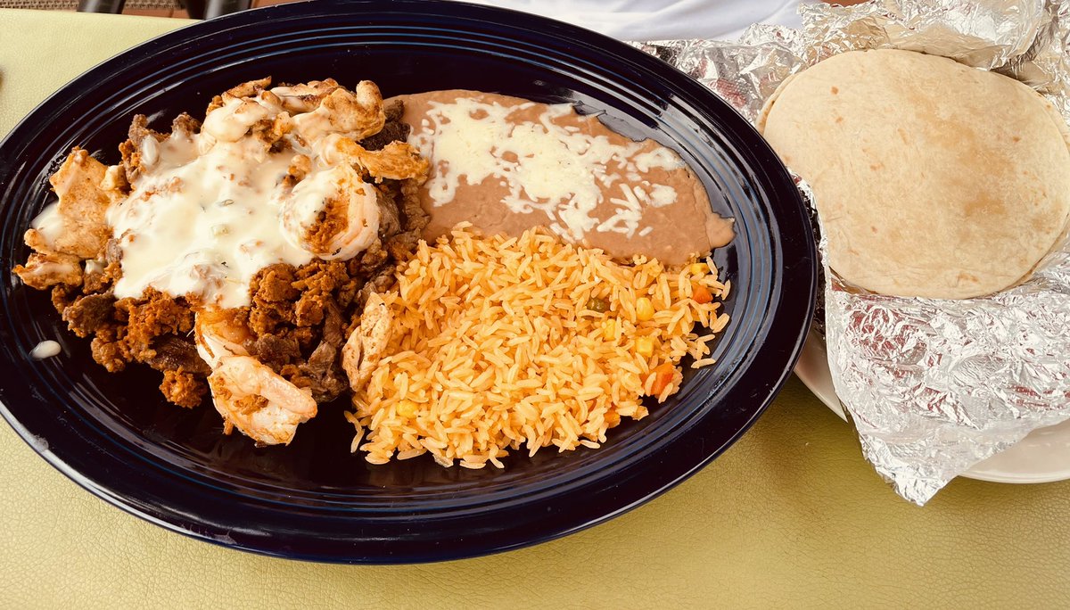 NoVARestaurants's tweet photo. Perfect Sunday afternoon on the patio with a queso-drenched burrito 🌯 and a large plate of “Chorti Mixto” with beef, shrimp and chicken — at El Paso in Centreville VA. https://t.co/nu2TXjFg8y