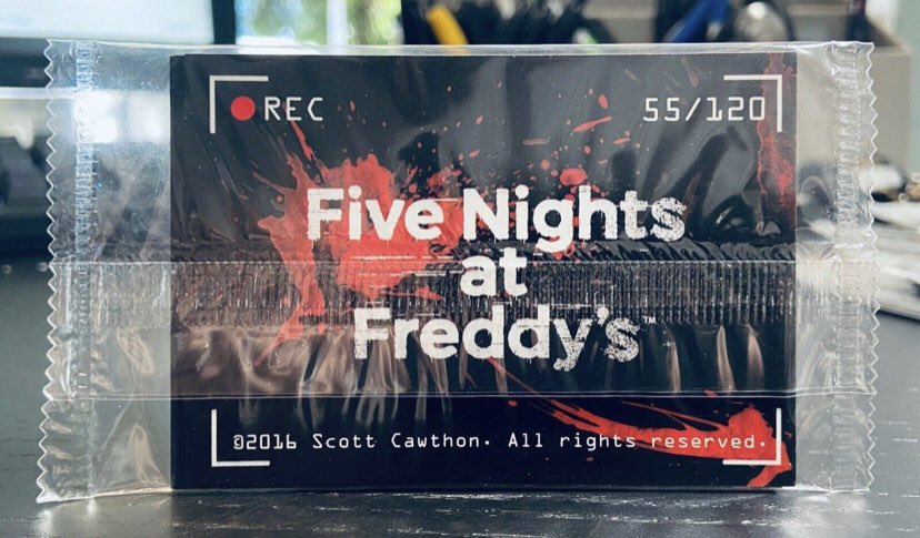 Tyler953914122's tweet photo. @Retro_Edge @PaulieEsther1 The camera design and the blood and static on the logo resembles the fnaf trading card https://t.co/DzGYZmnkFK