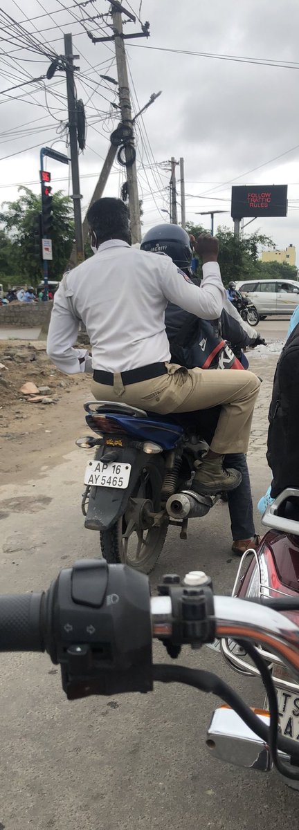 karu233's tweet photo. Seems like pillion rider helmet rules don’t apply to traffic police. @HYDTP @cyberabadpolice @GHMCOnline @CommissionrGHMC https://t.co/XNLt2mpQoA