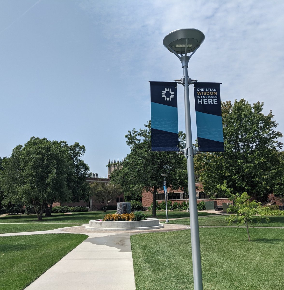 KurthBrashear's tweet photo. "Christian wisdom is fostered here." As @CUNE prepares for a new academic year, love the new signs going up around campus witnessing Christ and affirming #OurPromises of a Lutheran Education. #snapCUNE #LCMS #LuthEd @cccuorg https://t.co/MX2IFMuoRz