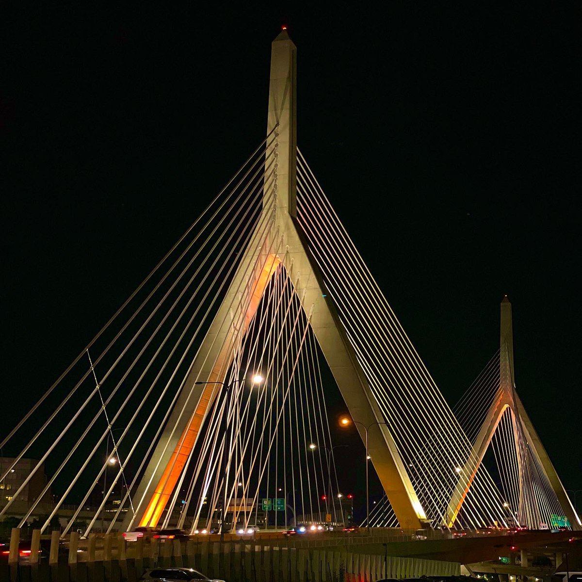 acpmpresearch's tweet image. #Boston looked gorgeous lit up amber for appendix cancer awareness month last night! 🧡🎗 (Pictured are the Zakim bridge and the Fore River bridge) #AugustforAppendixCancer