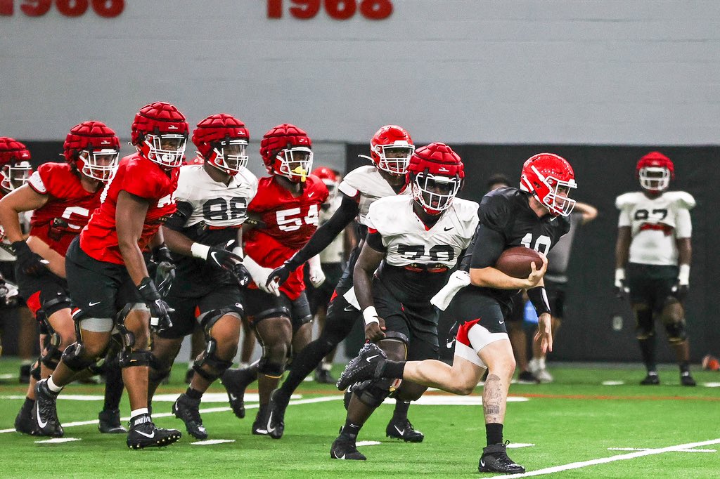 LoganMBooker's tweet photo. Gotta admire JT Daniels running freely around a bunch of dudes that know they’d lose their scholarship if they actually hit him.  #MobileQB 

📸 Mackenzie Miles/UGA https://t.co/DVbor5ez9W