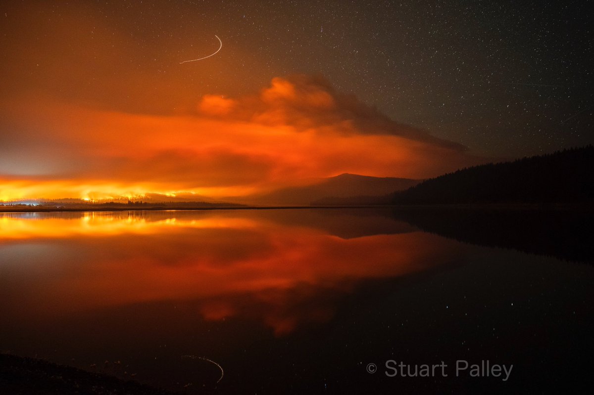 stuartpalley's tweet photo. The #dixiefire burns overnight in the Lassen NF outside of Chester, CA. There's another red flag warning today and the fire is expected to exhibit extreme behavior. This was at 230am with an active column and torching. Just wild. https://t.co/WF54N7jlJo