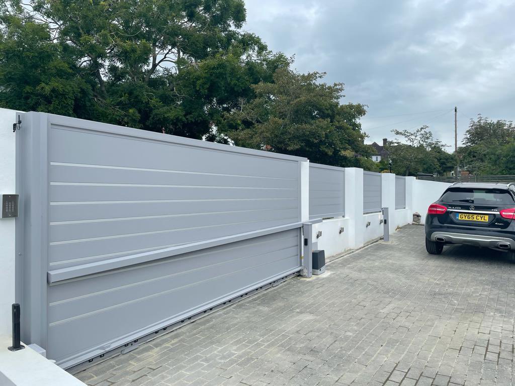 New aluminium sliding gate, side gate and fence panels all in stunning aluminium. Automated by Came BXV motor system and CameBpt Gsm intercom and keypad. #anotherCAMEcreation #electricgates #gatessussex #gatessurrey #slidinggates