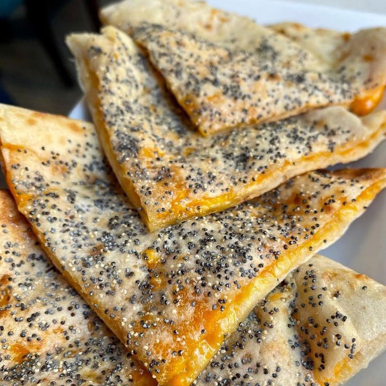 Our #PoppySeed &amp; #Red #Leicester #Cheese #naan#bread - the best way to spend a #rainy evening in #London!
.
.
#FloraIndica #ComfortFood #SouthKensington #EarlsCourt #Chelsea #IndianFood