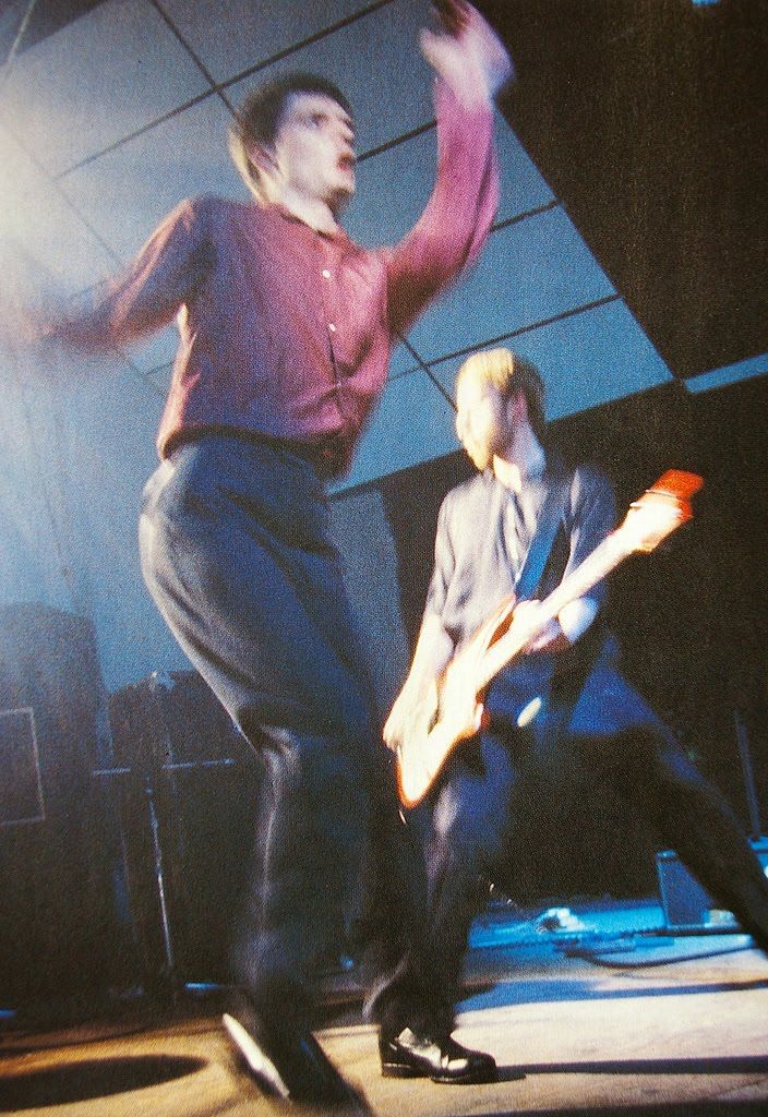 BoredWeb3's tweet photo. Ian Curtis &amp; Peter Hook on stage, 1979. 📷 Chris Mills. https://t.co/zouUFtZjhs