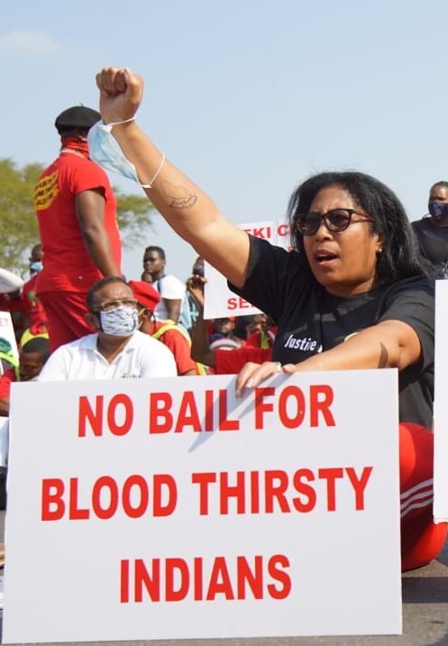 waldimar's tweet photo. The EFF does it again. Imagine the legitimate fury of the nation if a protester had carried a poster that said, "No bail for bloodthirsty blacks"? SA dutifully punishes racism against black compatriots, but too often condones racism directed at minorities. Not good. https://t.co/3zcxi7JjTX