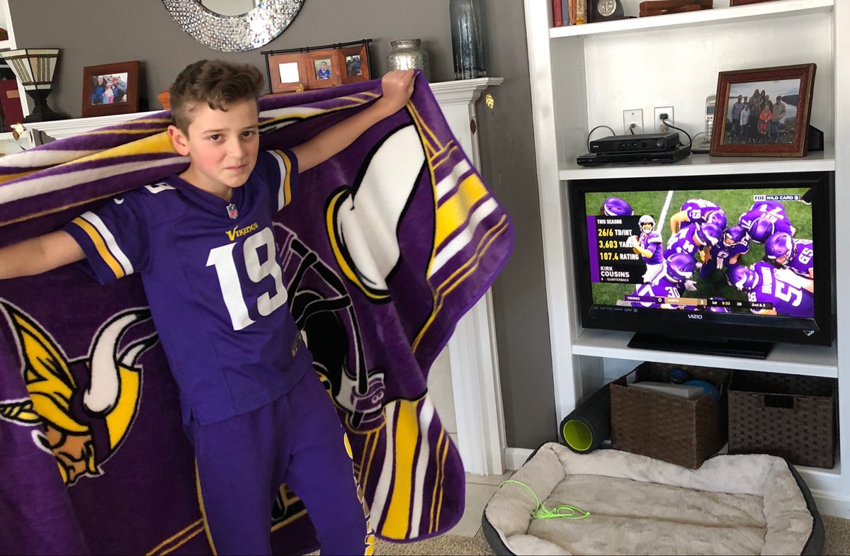 DavidRosowsky's tweet photo. A few years back Leo started following the Vikings. (Hey, he had one of the colors right!) Today he is the newest @kstate Wildcats fan. 💜🤍 #perfectinpurple https://t.co/aDXudQqAwi