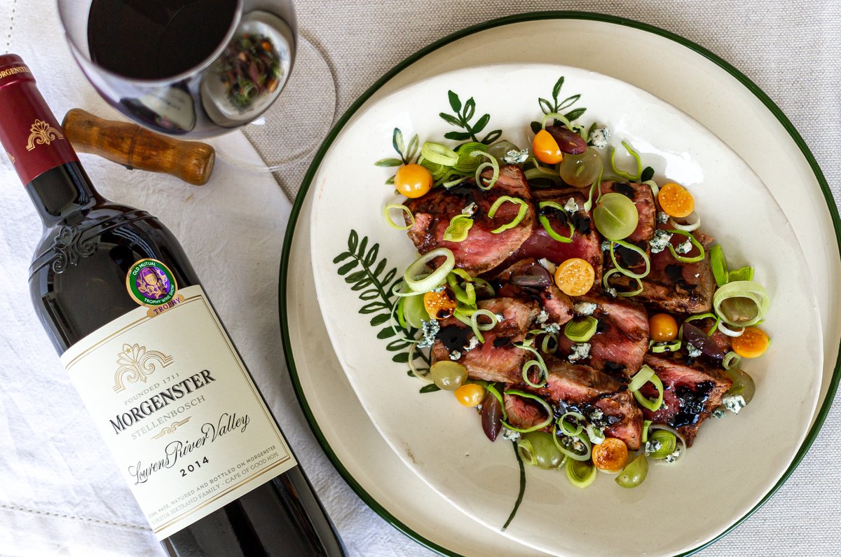 The saying goes you eat with your eyes... and we can’t get enough of this beautiful dish of balsamic-marinated steak, made even yummier with red grapes, blue cheese and spring onion. 

Add a glass of our Morgenster Lourens River Valley 2014 and...bit.ly/3xsulen