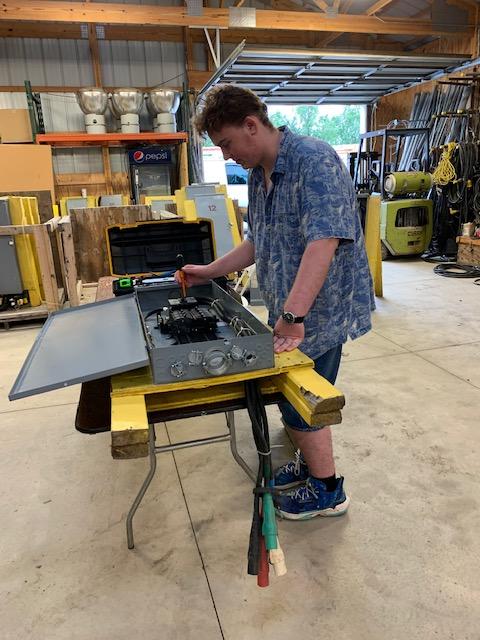 wnyptech's tweet photo. Electrical pathway students recently worked with Gary Horton, Erie County Fairgrounds Facilities Manager, to repair electrical boxes in preparation for The Erie County Fair, Aug. 11-22. Thank you for your work to ensure the fair operates safely &amp; efficiently. 

#CAMPTECH #PTECH https://t.co/VIR2dUwON0