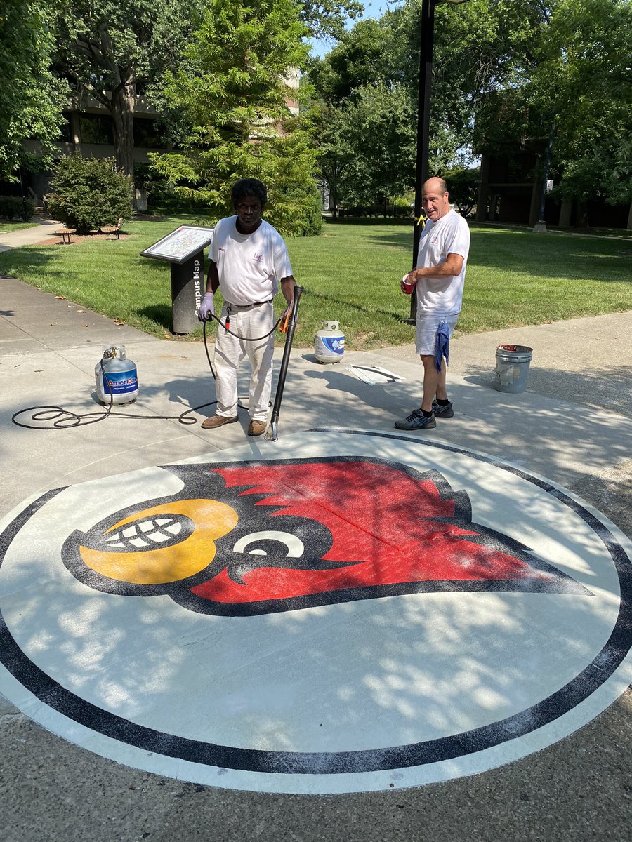 Artists at work — a sign that Fall is just around the corner! Go Cards!!