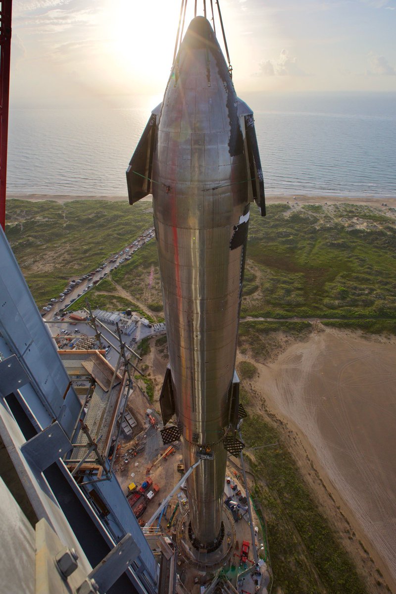 Kristennetten's tweet photo. There’s a strange irony to the fact the fully stacked @SpaceX Starship/ Superheavy is as tall as Lady Liberty 🗽, her being an emblem of liberty in new lands for travelers &amp; weary immigrants, Starship being just that for new planets etc @elonmusk 🚀 https://t.co/6qixkJ5yuD