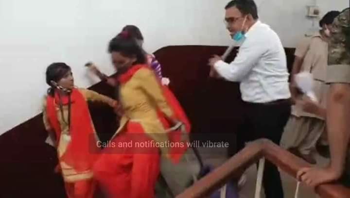 TripathiGee's tweet photo. Disturbing visuals from Dhanbad. Sub Divisional Magistrate beating up girls with a lathi. These girls were peacefully protesting against some issue concerning exams.                              #Dhanbad @NCWIndia @India_NHRC @smritiirani https://t.co/lO8Q3kUJFN