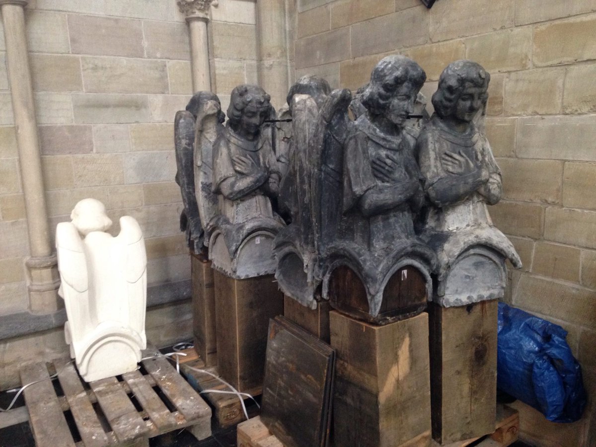 Looking back to 2015.  Redundant angels, replaced during the restoration of the spire of St. Martin's Ypres, look sorry for themselves in a corner of the church.  The one not speaking to the others is a spare replacement that wasn't needed.