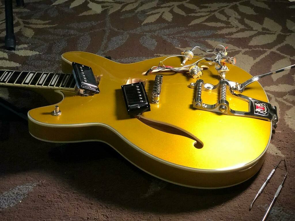 zeager's tweet photo. So this is happening right now 😳
Big changes on the way for this beauty to get a new lease on life!
#goldsparkle
#hagstromviking
#bigchanges
#semihollow https://t.co/5THW1ZggB3 https://t.co/4O3tjorh9E