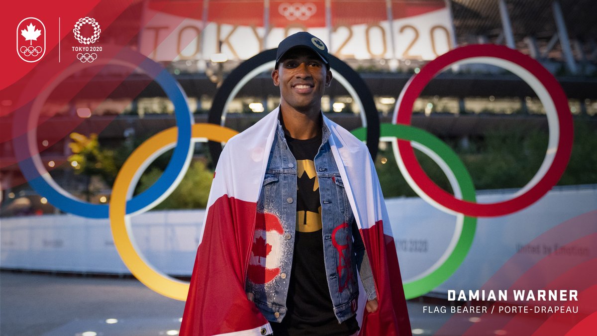 Damian Warner standing in front of Olympic rings at Tokyo 2020 with Canada flag draped around win. Text in corner says: Damian Warner, Flag Bearer / Porte-Drapeau 