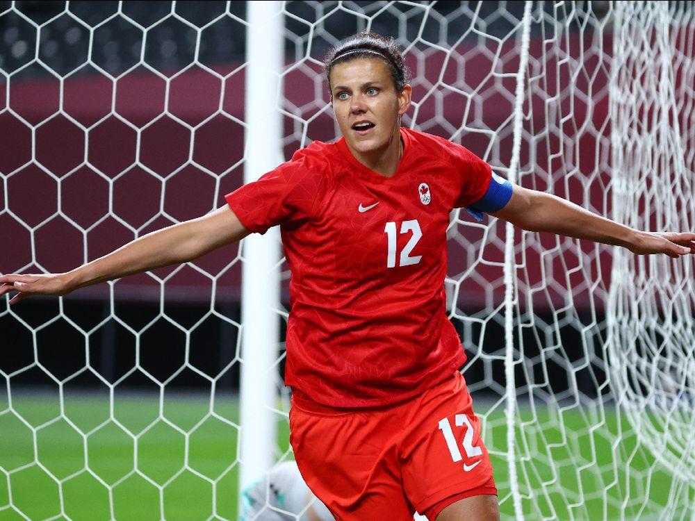 GOLD AT LAST Christine Sinclair's long, intentional run to the top of the Olympic podium