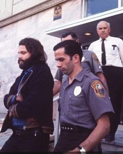 crockpics's tweet photo. Jim Morrison walking with police after being arrested in Miami, 1969 https://t.co/Kzs5ug2SjO