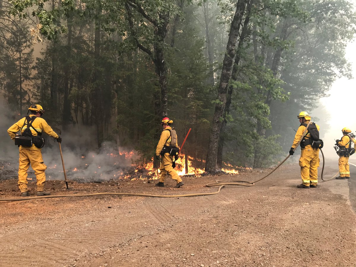 Firefighters putting out flames