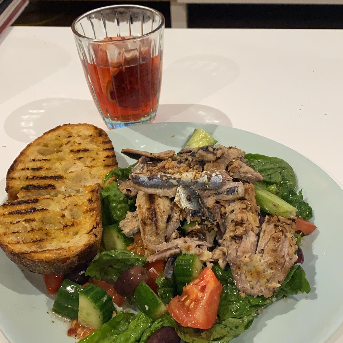 EveTGraham's tweet photo. Heater &amp; Spotify’s “Italian Chill” playlist turned right up! Grilled sardines with garlic, lemon &amp; olive oil, salad &amp; bread. *NB. Negroni not made with stockpiled ingredients - bought in fresh each lockdown 😆 https://t.co/M1xmRzIjmd