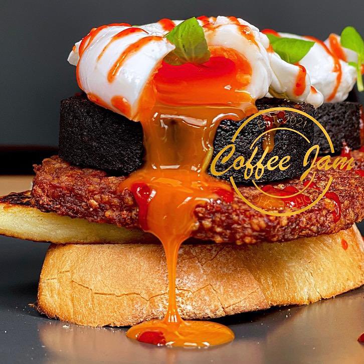 The Ultimate Jam 😍. Toasted sourdough, homemade potato scones, square sausage, poached eggs, black pudding topped with siracha jam sauce 🤤🤩😍