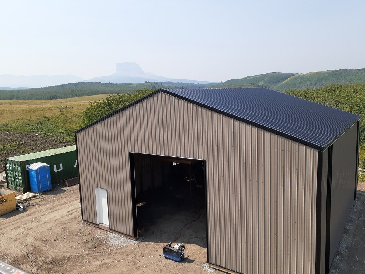 BouvetteRichard's tweet photo. Second building with Chief Mountain in the background. A little hazy from all of the smoke but still majestic just the same. #UFAStructures #Awesomelocation #UFAGetItDone #OutpostLakeAB https://t.co/5zDg47liFg