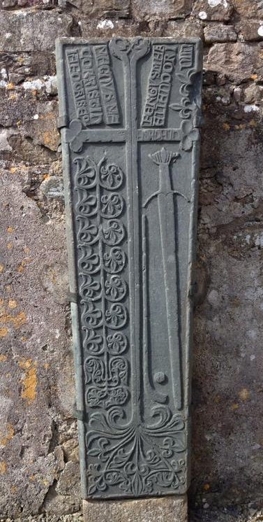 legacy_irish's tweet image. The 15th-16th century gravestone of a gallóglach warrior on the Inis Eoghain peninsula, Co. Donegal. It marks the grave of Magnus Mac Orristin, a Norse-Gael. The gravestone includes a hurley, sliotar and a sword, representing his interests. Fergus Mac Allan made the stone.