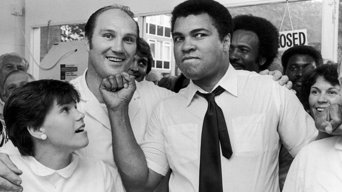 Muhammad Ali threatens Jack Bodell with an uppercut inside the former pig farmer's chip shop in Coventry, 1983. The 1961 ABA Light-Heavyweight champion overpowered Roy Seward to win the Midlands Light-Heavyweight Title in just his sixth professional fight