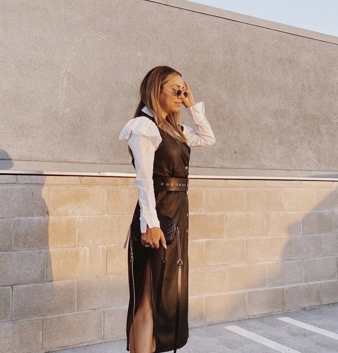 Golden hour goddess ✨ @fashionbyvicky is glowing in the Nightfall Vegan Leather Shirtdress + tap to explore her look! And now available to shop on @bergdorfs ! #plasticfree