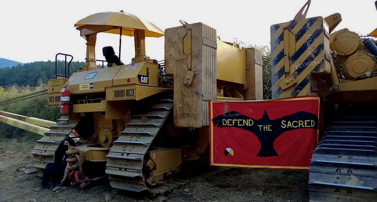 This morning, nearly 100 pipeline fighters stopped MVP construction in Elliston, VA. Ten of them have locked down to equipment or wooden structures on site.