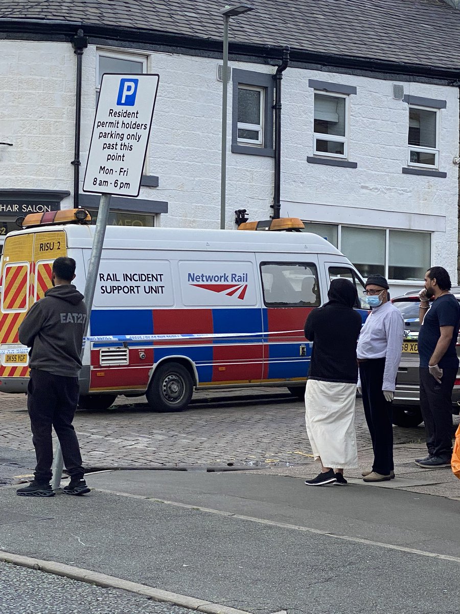 Lots of people gathering to watch after a suspicious package was reportedly found on a train - the train was stopped at Darwen to allow police to investigate