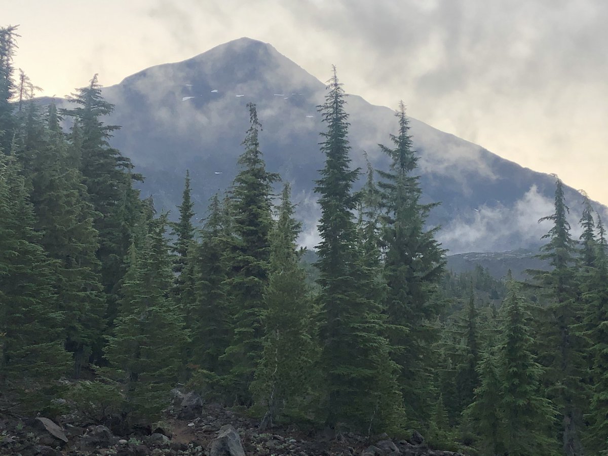 medwards61's tweet photo. After 41 days on the PCT, I have traveled 827 miles. Photos of Three Sisters Wilderness: Rock Mesa and South Sister in the smoky haze,  Middle Sister in the clouds, Obsidian Falls, and me with North and Middle Sisters in the background. https://t.co/vHXSg9Dvu9