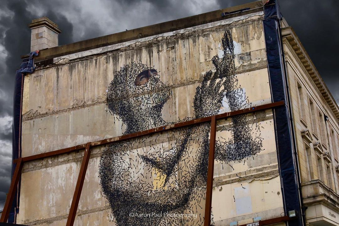 Have you spotted Dublin's newest street art ""Pass Freely"", honouring the lives lost to COVID-19 💙 Made using 4989 burnt matches, it took 10 days to create and we think it looks incredible! via @aaronpaulphotography

Artist @artofasbestos
