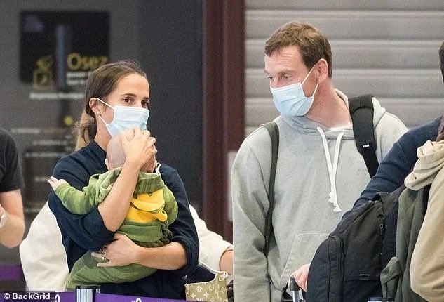 Alicia Vikander is every inch the doting mum as she enjoys a day out in  Paris with her baby