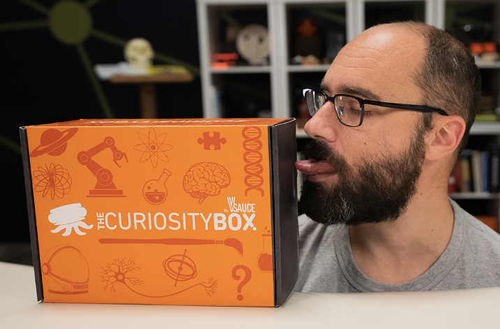 Michael Stevens licking the summer curiosity box