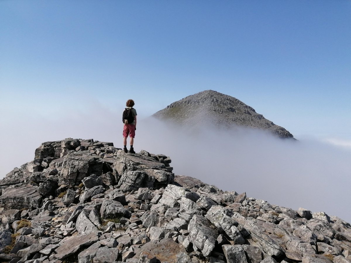 mountain_eering's tweet photo. Suddenly the cloud around us faded and a mighty peak rose up from the mist #leedsmc #leedsmountaineering #scrambling #hiking #liathach #walkingonair https://t.co/HKQsSiJ4iG